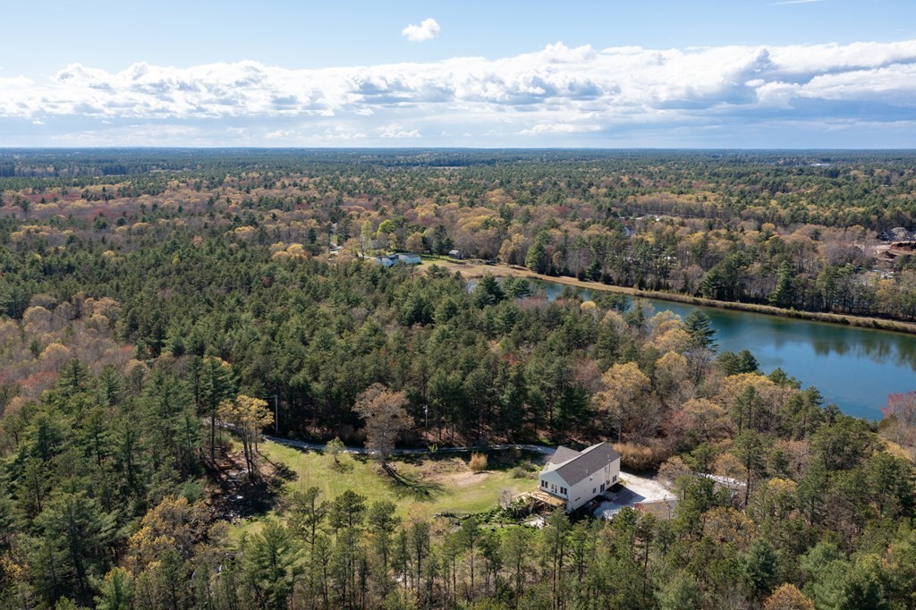 249 Blackmore Pond Road Wareham, MA 02576 - Photo 35 of 41 an aerial view of a house with a lake view