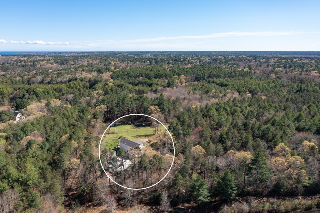 249 Blackmore Pond Road Wareham, MA 02576 - Photo 37 of 41 an aerial view of a house with a yard
