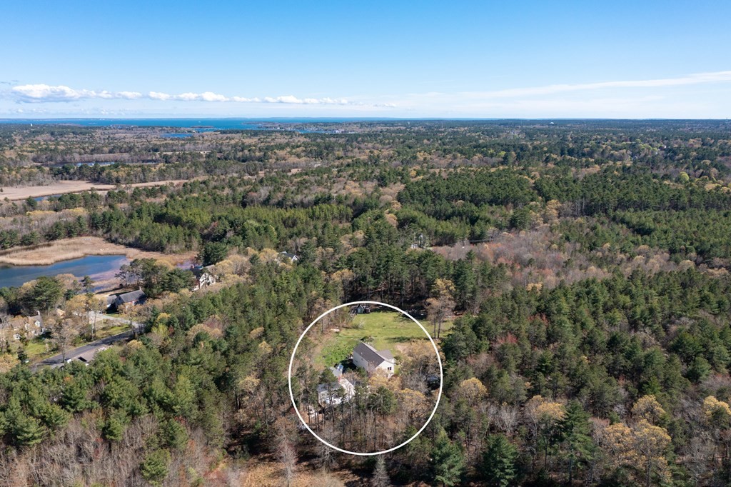 249 Blackmore Pond Road Wareham, MA 02576 - Photo 38 of 41 an aerial view of a house with a yard and lake view
