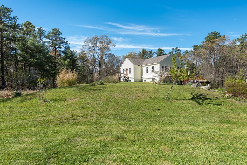 249 Blackmore Pond Road Wareham, MA 02576 - Photo 4 of 41 a view of a house with a big yard