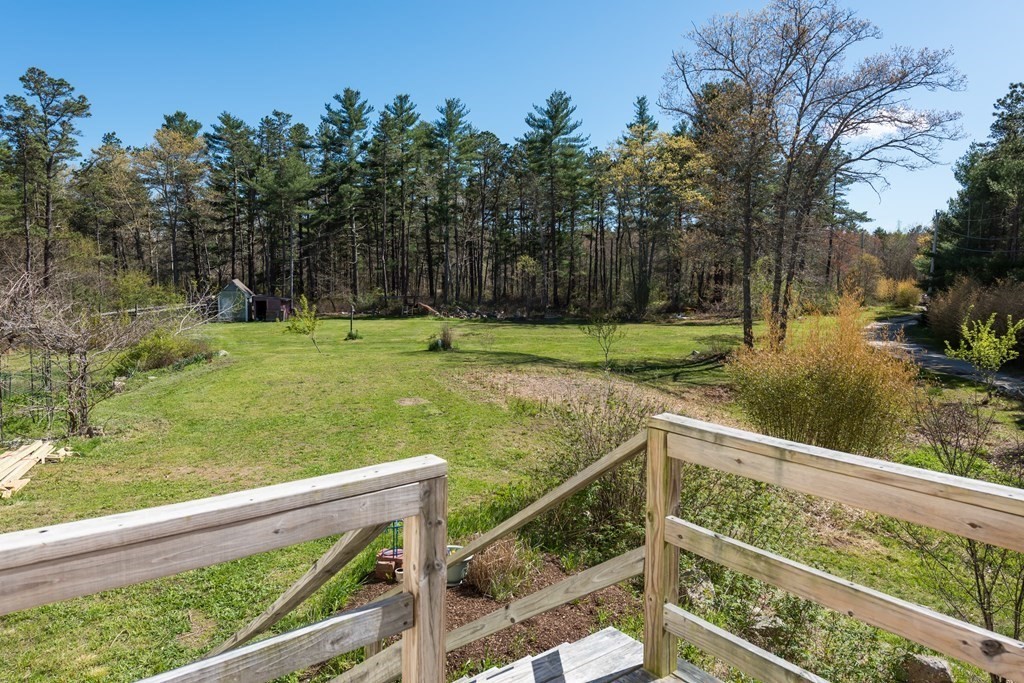 249 Blackmore Pond Road Wareham, MA 02576 - Photo 7 of 41 a view of a backyard with wooden fence