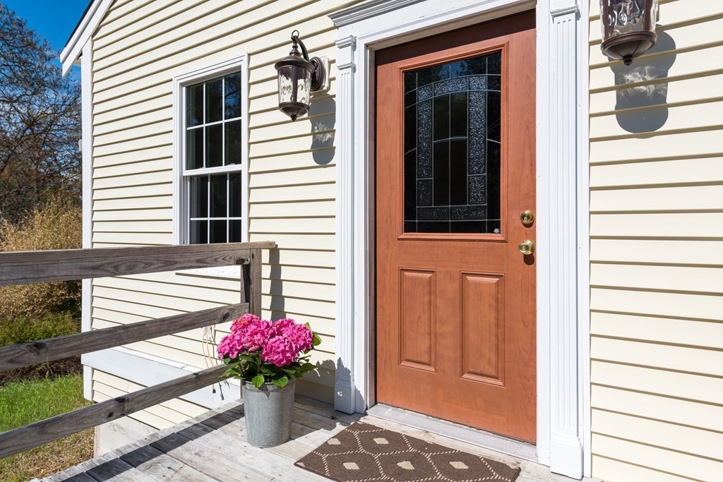 249 Blackmore Pond Road Wareham, MA 02576 - Photo 8 of 41 a view of a house with a potted plant