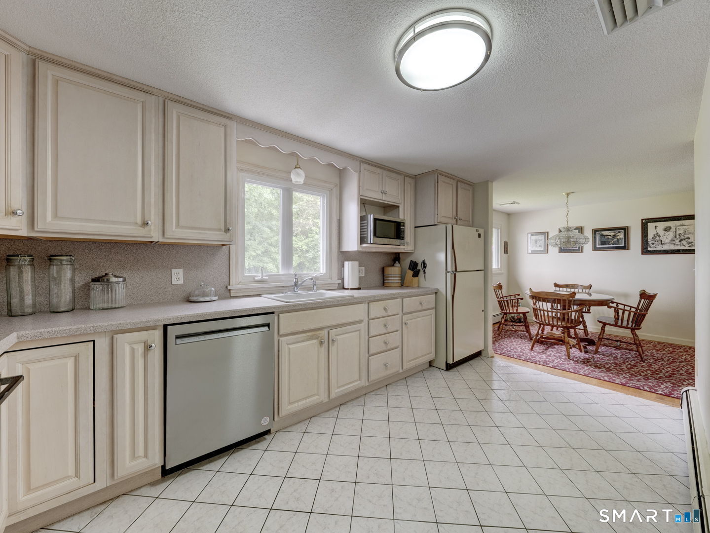 53 Goodwin Drive Somers, CT 06071 - Photo 7 of 22 a kitchen with cabinets and chairs
