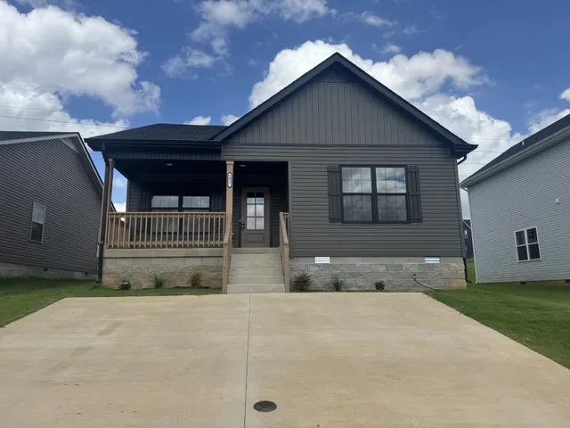 a front view of a house with garage