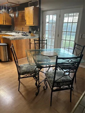 a view of a dining room with furniture and window