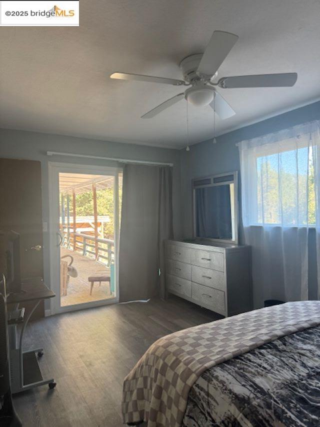 21890 Phoenix Lake Road Sonora, CA 95370 - Photo 11 of 22 Bedroom with access to exterior, dark wood-type flooring, and ceiling fan