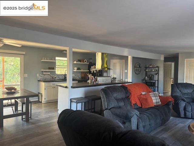 21890 Phoenix Lake Road Sonora, CA 95370 - Photo 15 of 22 Living area featuring dark wood-style flooring and ceiling fan