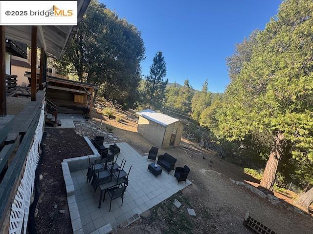 21890 Phoenix Lake Road Sonora, CA 95370 - Photo 3 of 22 View of patio / terrace with a storage unit