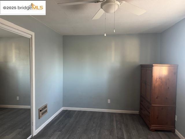 21890 Phoenix Lake Road Sonora, CA 95370 - Photo 9 of 22 Unfurnished bedroom with dark wood-style floors and ceiling fan