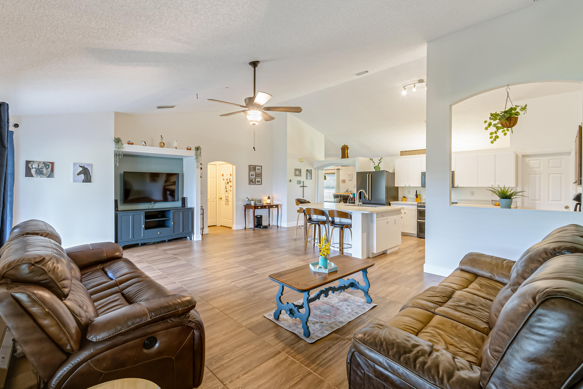 328 Deer Run Road Palm Bay, FL 32909 - Photo 12 of 50 328-Deer-Run-family room towards bedroom