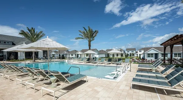 a front view of a house with swimming pool