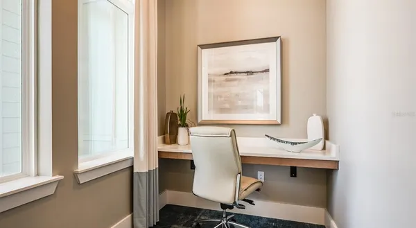 a dining room with furniture and window