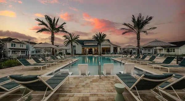 a view of a house with pool porch and furniture
