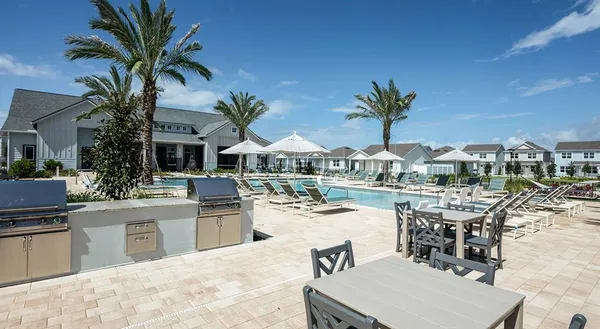 a view of a kitchen with kitchen island and a stove