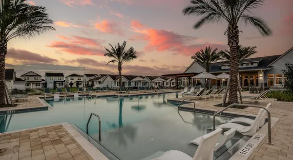 a view of a lake with outdoor seating space