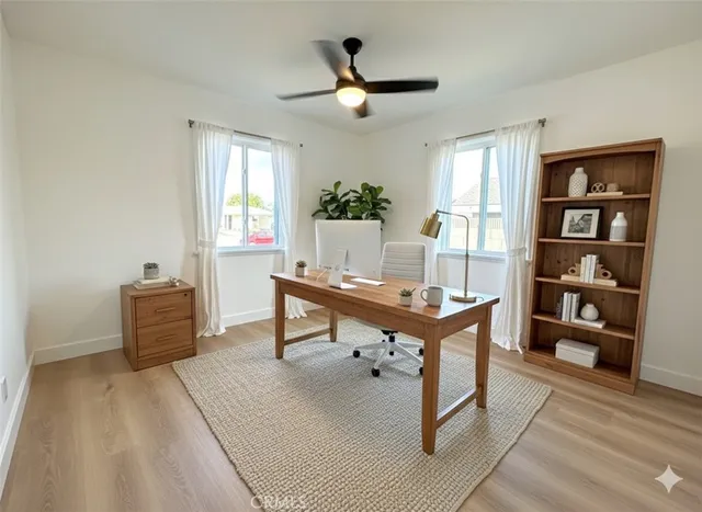 a living room with furniture a window and a table