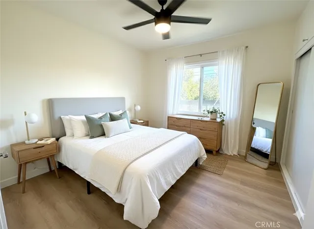 a bedroom with bed and window