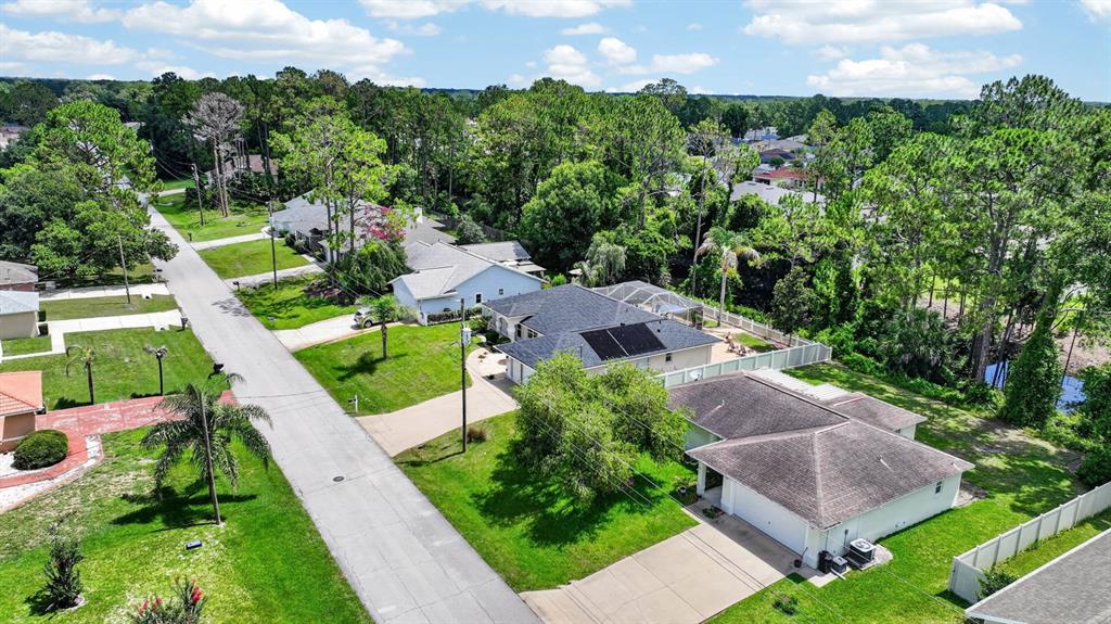 80 Roxboro Drive Palm Coast, FL 32164 - Photo 35 of 39 an aerial view of a house with a garden