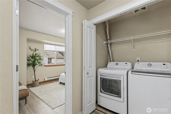 a utility room with dryer and washer