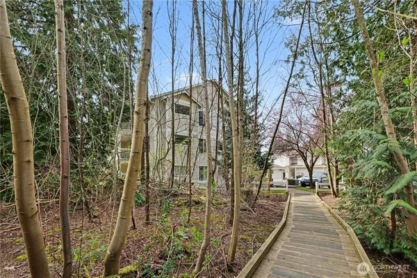 a front view of a building with a yard