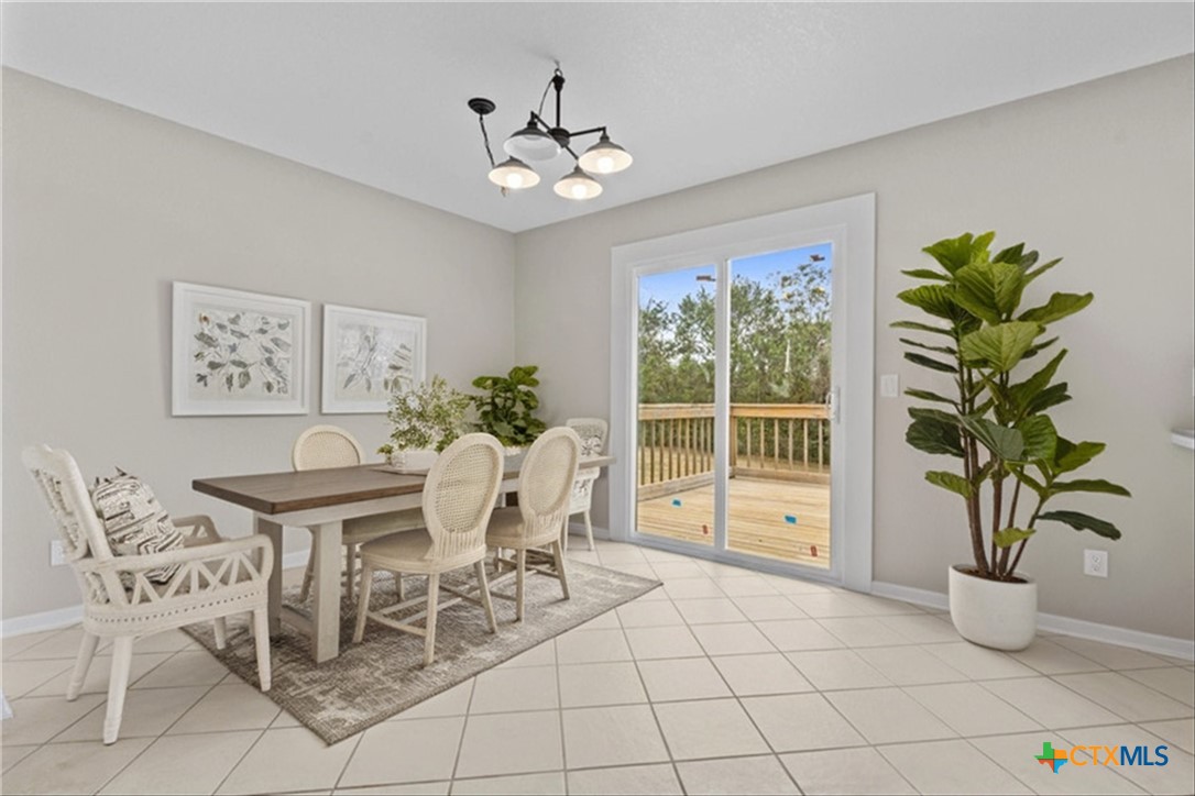 180 County Road 4933 Kempner, TX 76539 - Photo 10 of 24 a view of a dining room with furniture and a potted plant