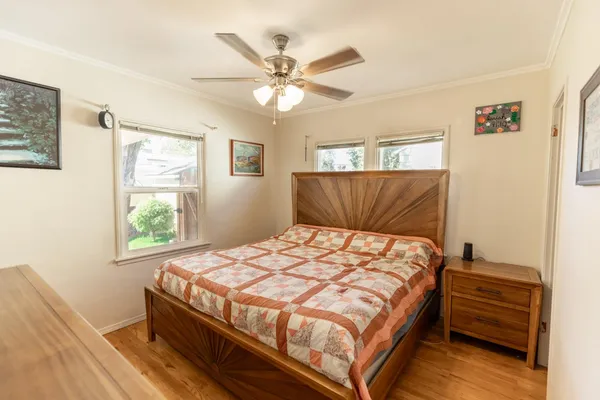 a bedroom with a bed and window