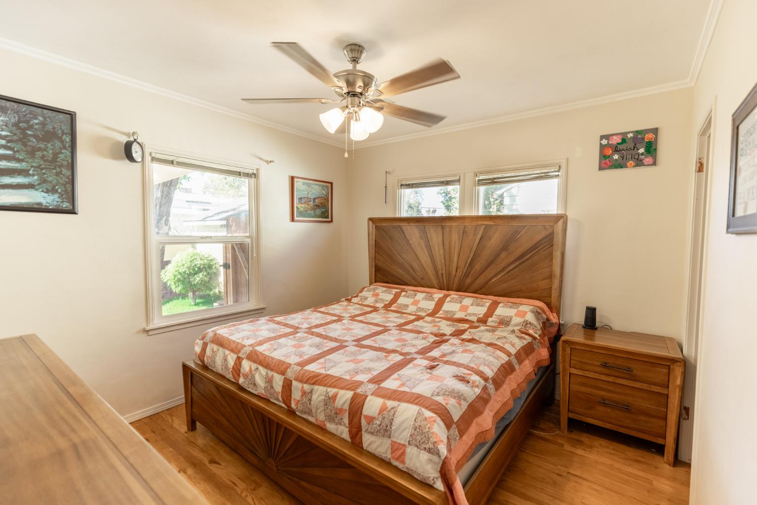 230 West 25th Street Merced, CA 95340 - Photo 14 of 20 a bedroom with a bed and window
