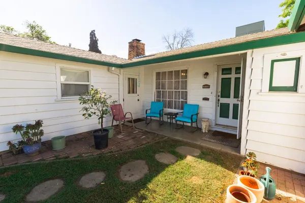 a backyard of a house with seating space