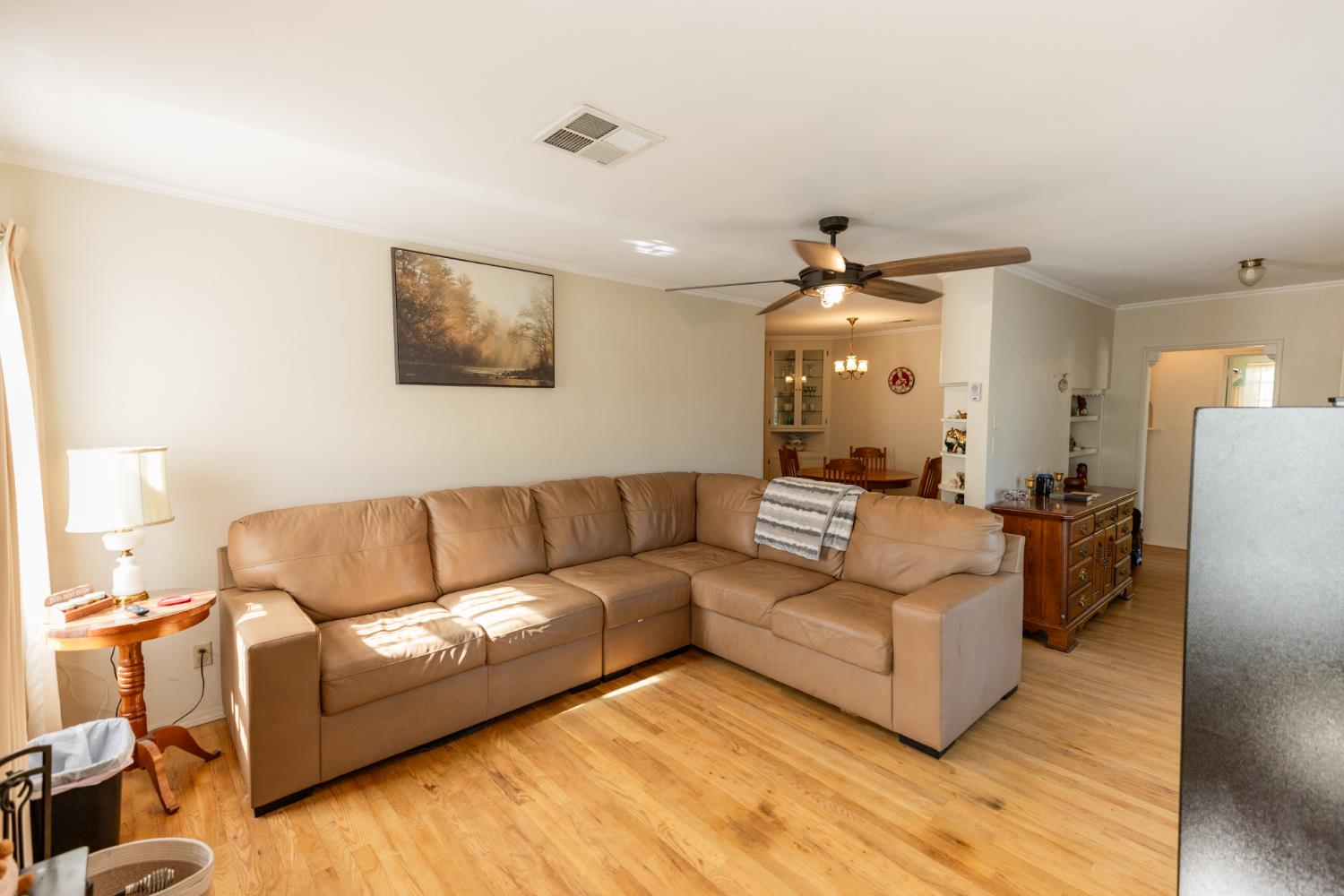230 West 25th Street Merced, CA 95340 - Photo 5 of 20 a living room with furniture and a chandelier