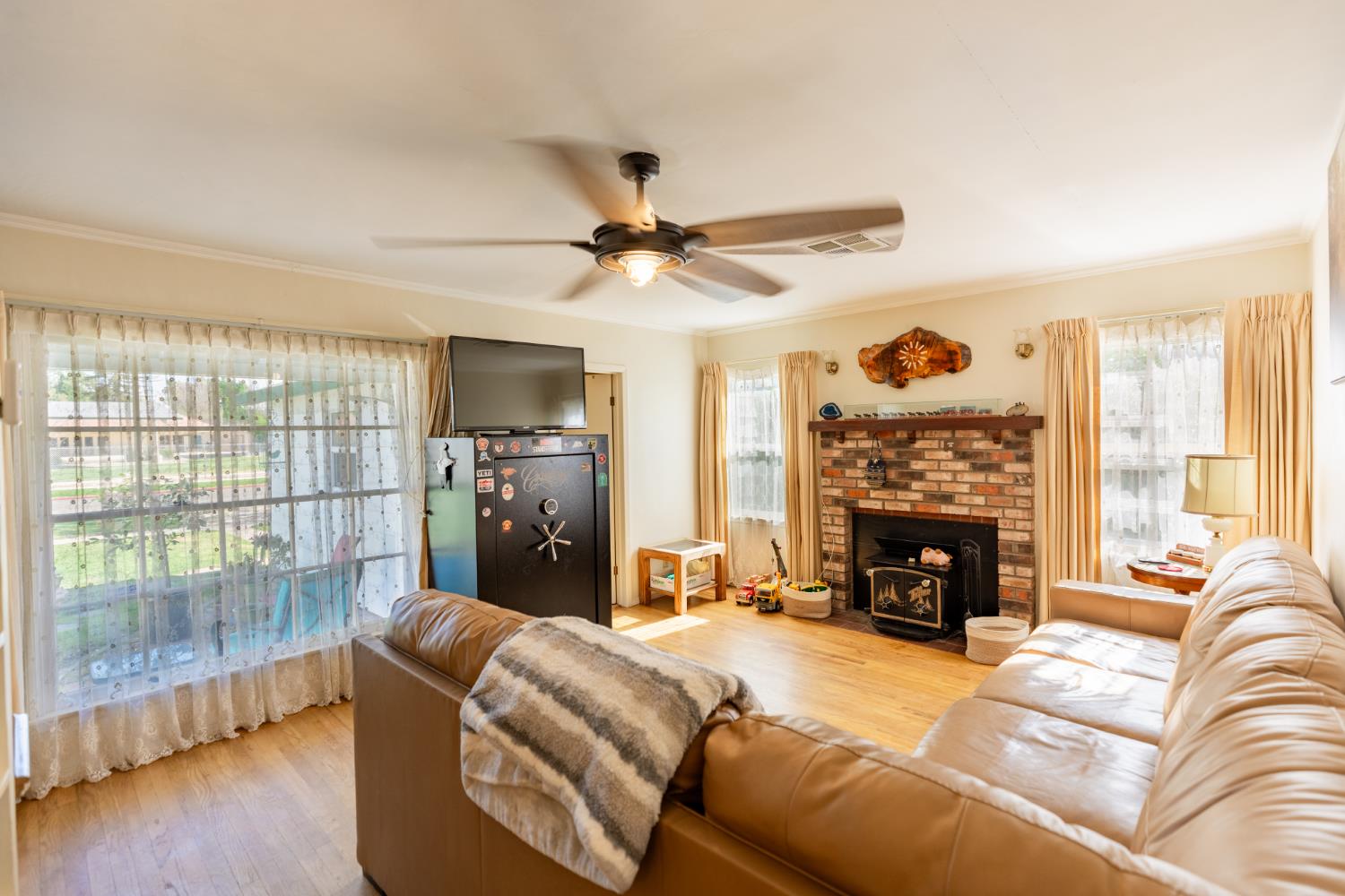 230 West 25th Street Merced, CA 95340 - Photo 8 of 20 a living room with furniture and a fireplace