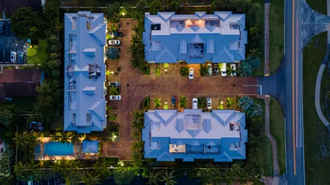 an aerial view of residential house with outdoor space and parking