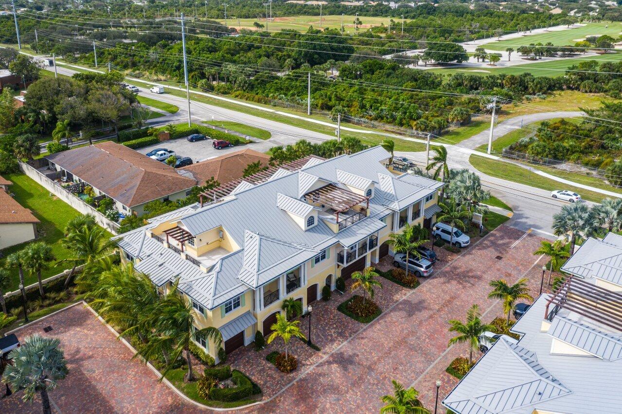 3770 County Line Road Tequesta, FL 33469 - Photo 10 of 42 an aerial view of a house with a garden