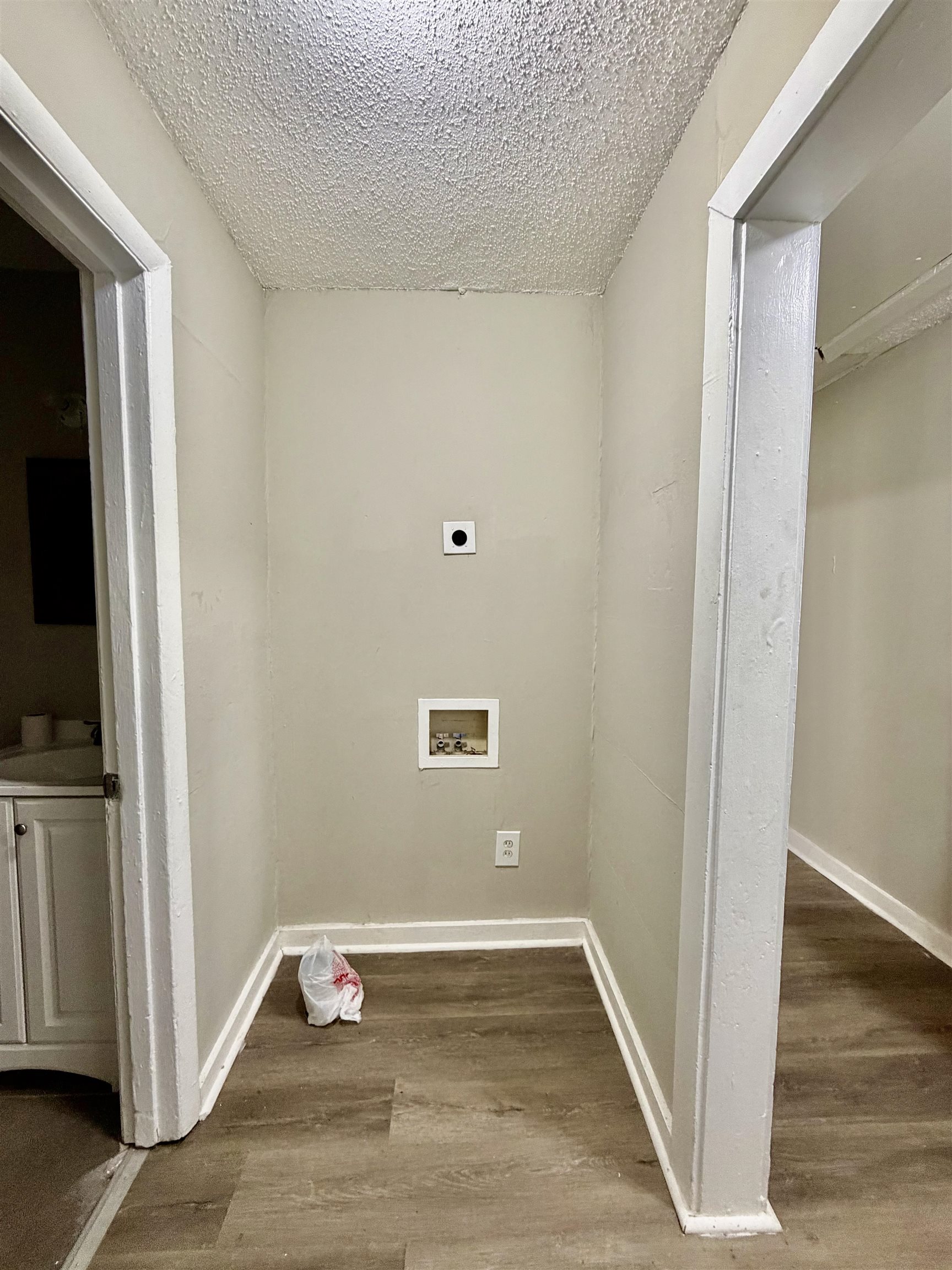 1448 Menager Road Memphis, TN 38106 - Photo 11 of 17 a view of an empty room with wooden floor and a window