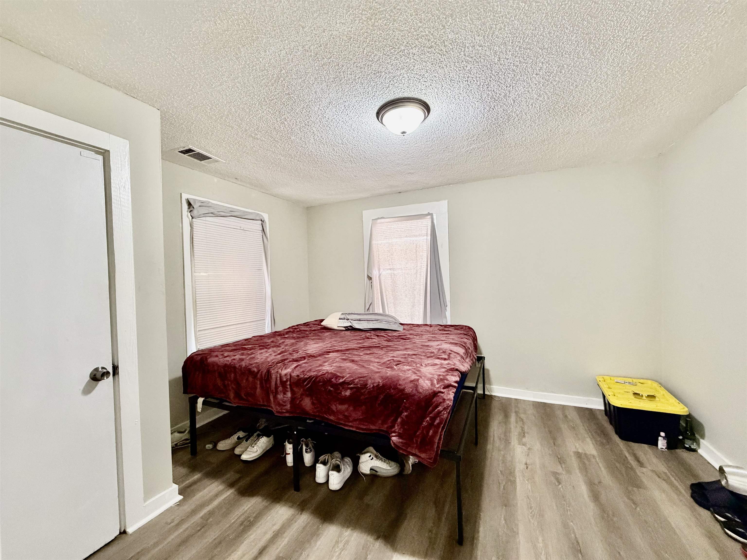 1448 Menager Road Memphis, TN 38106 - Photo 17 of 17 a bed room with a bed and a table