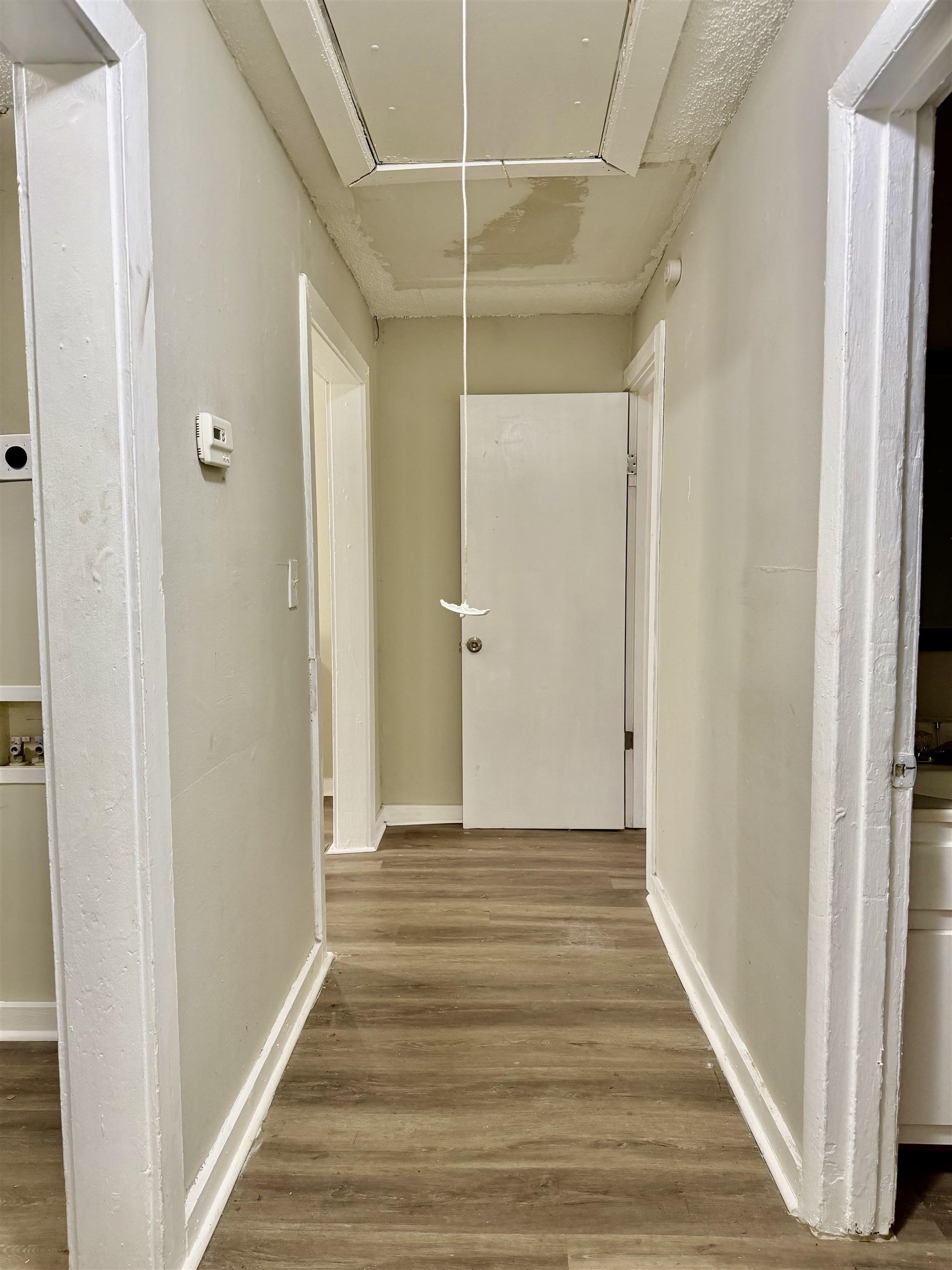 1448 Menager Road Memphis, TN 38106 - Photo 6 of 17 a view of a hallway with wooden floor