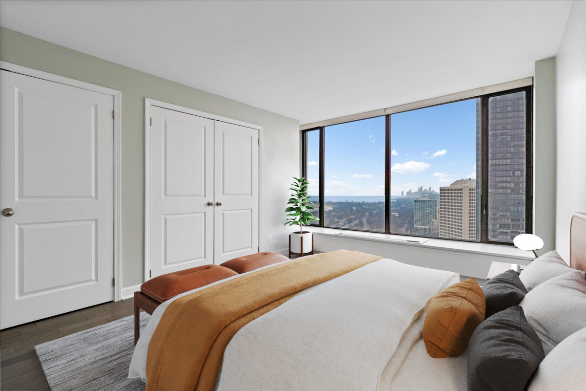 5455 North Sheridan Road, Unit 3406 Chicago, IL 60640 - Photo 17 of 30 a bedroom with a bed and glass window