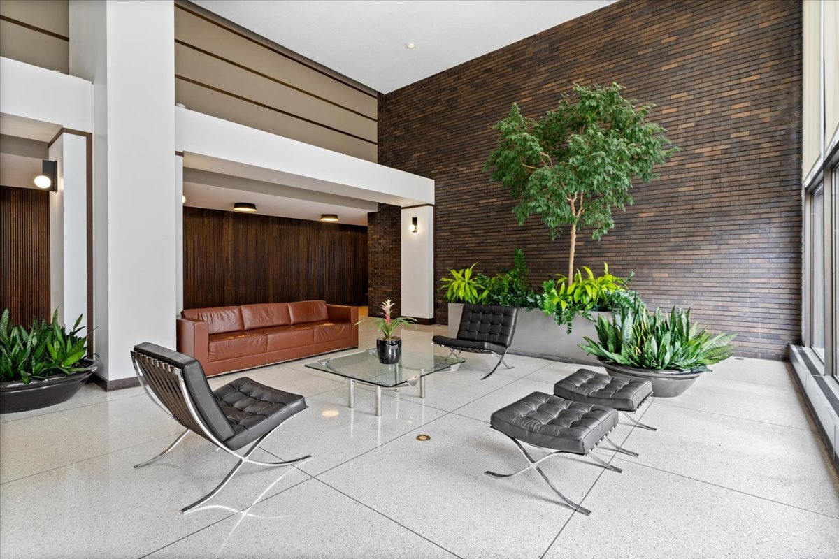 5455 North Sheridan Road, Unit 3406 Chicago, IL 60640 - Photo 29 of 30 a building outdoor space with patio furniture and potted plants