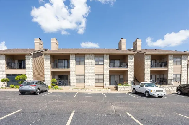 a view of a car parked in front of a building
