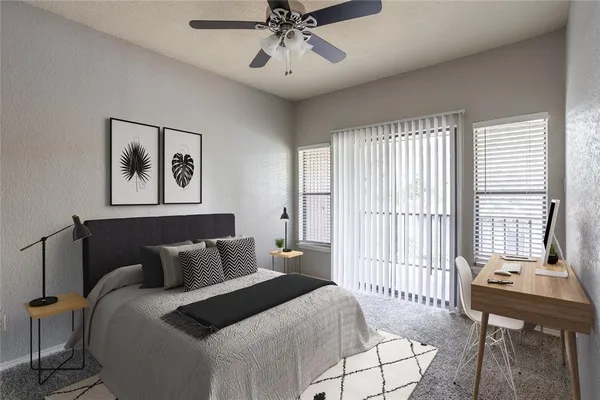 a bedroom with a bed and a table