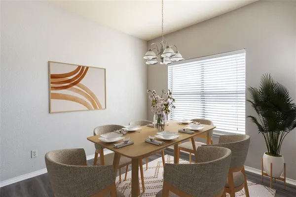 a dining room with furniture and window