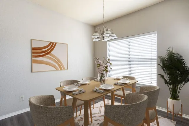 a dining room with furniture and window