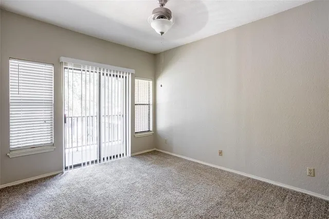 an empty room with a empty space and windows