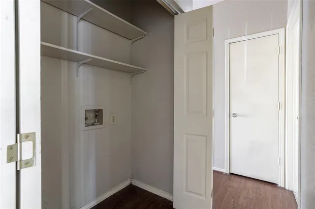 a view of front door with wooden floor