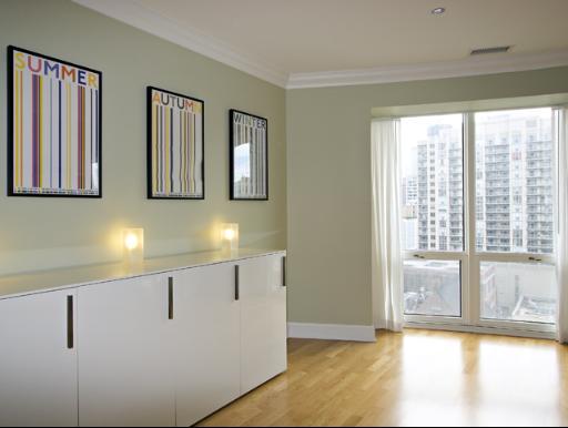 60 West Erie Street, Unit 1102 Chicago, IL 60654 - Photo 11 of 12 a view of an empty room with window and kitchen view