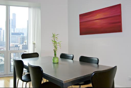60 West Erie Street, Unit 1102 Chicago, IL 60654 - Photo 5 of 12 a view of a workspace with furniture and a window