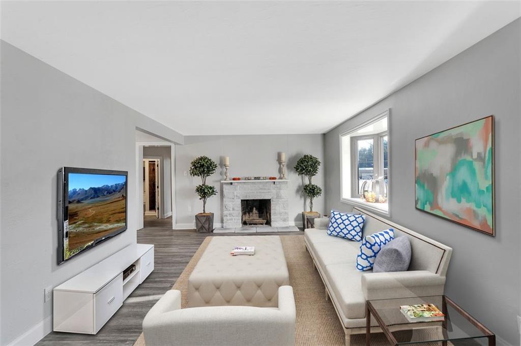 225 Houston Road Pittsburgh, PA 15237 - Photo 11 of 25 a living room with furniture a flat screen tv and a fireplace