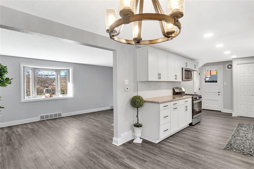 225 Houston Road Pittsburgh, PA 15237 - Photo 13 of 25 a kitchen with stainless steel appliances a stove a refrigerator and a chandelier