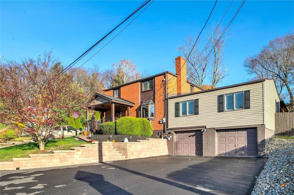 225 Houston Road Pittsburgh, PA 15237 - Photo 2 of 25 a front view of a house with a yard