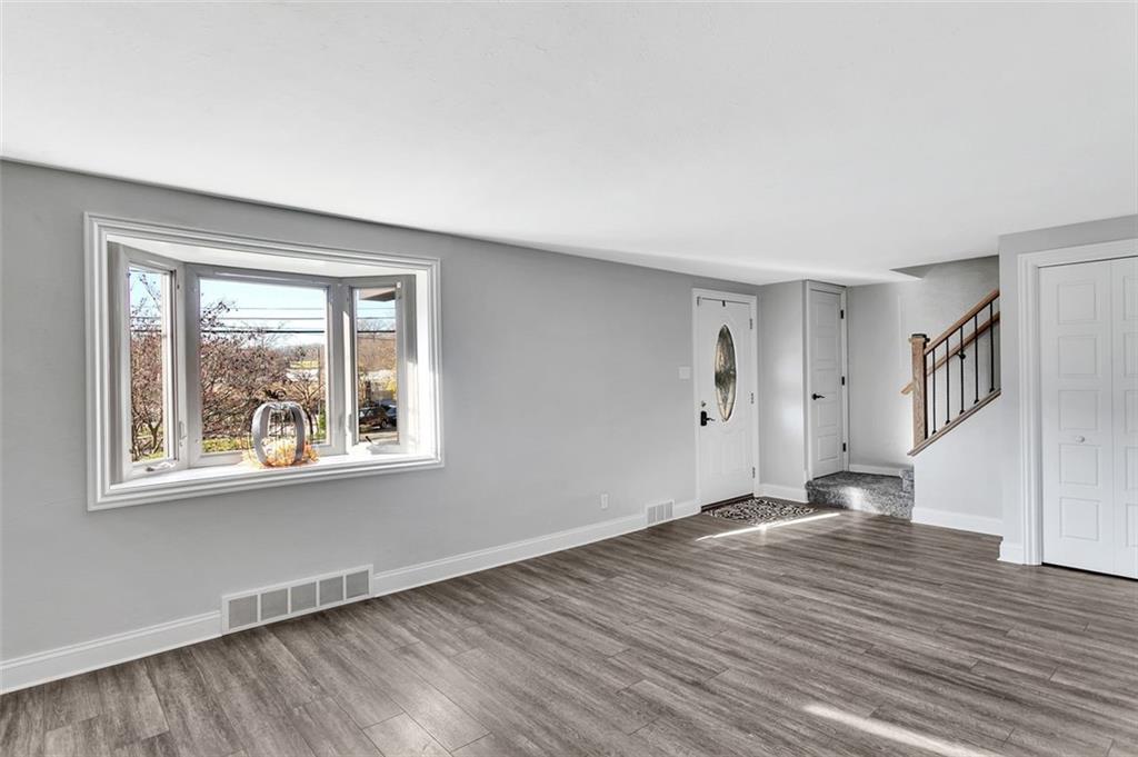 225 Houston Road Pittsburgh, PA 15237 - Photo 10 of 25 a view of an empty room with wooden floor and a window