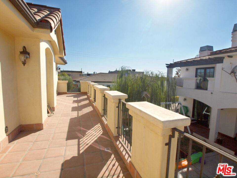1644 Hi Point Street Los Angeles, CA 90035 - Photo 2 of 11 a view of a patio with a table and chairs